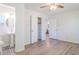 Bright bedroom featuring wood floors, ensuite bathroom, and ceiling fan at 317 Community Sw Dr, Mableton, GA 30126