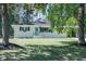 Charming single-story home featuring a well-maintained lawn and delightful blue front door at 317 Community Sw Dr, Mableton, GA 30126