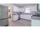 Modern kitchen featuring stainless steel appliances, white cabinets, and stylish countertops at 317 Community Sw Dr, Mableton, GA 30126