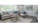 Cozy living room featuring modern furniture, stylish decor, and lots of natural light at 317 Community Sw Dr, Mableton, GA 30126