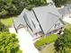Stunning aerial view of a home with a three-car garage, spacious driveway, and well-maintained landscaping at 330 Bay Grove Rd, Loganville, GA 30052