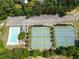 Overhead perspective showcases tennis courts, pool, and parking area, ideal for active community engagement at 330 Bay Grove Rd, Loganville, GA 30052