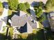 Expansive property featuring lush backyard with patio, firepit, mature trees, and a large driveway at 330 Bay Grove Rd, Loganville, GA 30052