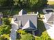 An aerial view reveals a well-maintained property with a pool, patio, and lush greenery surrounding the home at 330 Bay Grove Rd, Loganville, GA 30052