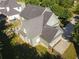Overhead view showcases the home's roof, exterior siding, patio, and backyard at 330 Bay Grove Rd, Loganville, GA 30052