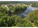 Scenic aerial shot of a lake surrounded by lush greenery and homes, perfect for enjoying nature and outdoor activities at 330 Bay Grove Rd, Loganville, GA 30052