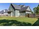 This green home has a spacious, grassy backyard, perfect for enjoying outdoor living and entertaining at 330 Bay Grove Rd, Loganville, GA 30052