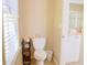 Powder room featuring toilet and a white vanity at 330 Bay Grove Rd, Loganville, GA 30052
