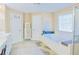 Bright bathroom features a large soaking tub, walk-in shower, and vanity at 330 Bay Grove Rd, Loganville, GA 30052