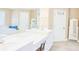 Bathroom featuring double sinks, mirrors, white cabinets, and tile floors at 330 Bay Grove Rd, Loganville, GA 30052