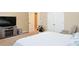 Bedroom with tv, door to closet, and bright natural light at 330 Bay Grove Rd, Loganville, GA 30052