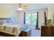 Cozy bedroom with natural light, ceiling fan, and carpet at 330 Bay Grove Rd, Loganville, GA 30052