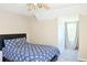 Cozy bedroom featuring a comfortable bed, window with natural light and neutral colors, offering relaxation at 330 Bay Grove Rd, Loganville, GA 30052