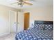 Warm bedroom featuring a comfortable bed, neutral colors and a ceiling fan, for relaxation at 330 Bay Grove Rd, Loganville, GA 30052