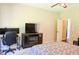 Bedroom featuring neutral walls, fireplace, and desk area at 330 Bay Grove Rd, Loganville, GA 30052