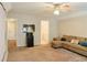 Open bonus room with a seating area and wet bar area, great for relaxing and watching movies at 330 Bay Grove Rd, Loganville, GA 30052