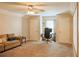 Spacious bonus room with a comfortable seating area and desk space, perfect for entertaining at 330 Bay Grove Rd, Loganville, GA 30052