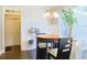 Sun-filled breakfast nook with a round table, wainscoting and large window at 330 Bay Grove Rd, Loganville, GA 30052