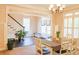Dining room with a view of the staircase and the entryway with a white door and sidelights at 330 Bay Grove Rd, Loganville, GA 30052