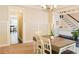Dining room with open view to a seating room and a staircase with a white banister at 330 Bay Grove Rd, Loganville, GA 30052