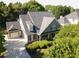 Beautiful traditional home boasts professional landscaping and an attached two car garage at 330 Bay Grove Rd, Loganville, GA 30052