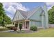 Inviting home with a covered front porch, well-maintained landscaping, and classic architectural details at 330 Bay Grove Rd, Loganville, GA 30052