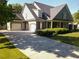 Charming home with a two-car garage, and a welcoming front porch at 330 Bay Grove Rd, Loganville, GA 30052
