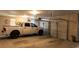 Spacious three-car garage with ample room for parking and storage including a white pickup truck at 330 Bay Grove Rd, Loganville, GA 30052