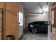 A two-car garage with an electric car and room for storage offers convenience and functionality at 330 Bay Grove Rd, Loganville, GA 30052