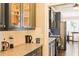 The kitchen has dark gray cabinets, granite countertops, and stainless steel appliances at 330 Bay Grove Rd, Loganville, GA 30052