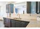 A kitchen with gray cabinets, granite countertops and stainless steel appliances at 330 Bay Grove Rd, Loganville, GA 30052