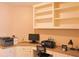 Bright home office features a desk and built-in shelving, ideal for remote work at 330 Bay Grove Rd, Loganville, GA 30052