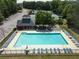 Overhead perspective shows the pool, pool house, playground and tennis courts of this community at 330 Bay Grove Rd, Loganville, GA 30052