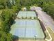 Aerial view of community tennis courts surrounded by lush greenery at 330 Bay Grove Rd, Loganville, GA 30052