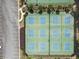 Overhead view of multiple outdoor tennis courts adjacent to a parking lot and manicured landscaping at 330 Bay Grove Rd, Loganville, GA 30052