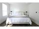 Bright bedroom featuring neutral decor, wood-look flooring, and modern lamps at 4811 Lake Park Ter, Acworth, GA 30101