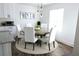 Cozy dining room with a round table, white chairs, and natural light at 4811 Lake Park Ter, Acworth, GA 30101