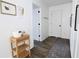 Bright hallway featuring wood floors, minimalist decor and white doors at 4811 Lake Park Ter, Acworth, GA 30101