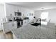 Kitchen with white cabinets, stainless steel appliances, and a granite countertop island at 4811 Lake Park Ter, Acworth, GA 30101