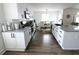 Bright kitchen featuring white cabinets, stainless steel appliances, granite counters and an adjacent dining area at 4811 Lake Park Ter, Acworth, GA 30101
