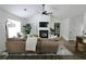 Stylish living room with a fireplace, mounted television, and cozy sectional sofa at 4811 Lake Park Ter, Acworth, GA 30101