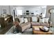 Inviting living room with comfortable seating and open to dining and kitchen at 4811 Lake Park Ter, Acworth, GA 30101