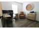 Well-lit office with hardwood floors, a desk with dual monitors, and natural wood furnishings at 4811 Lake Park Ter, Acworth, GA 30101