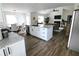 Open-concept layout showcasing the kitchen island, dining area, and living room at 4811 Lake Park Ter, Acworth, GA 30101