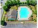 Overhead view of the community pool, clubhouse, ample parking and gardens at 634 Friars Head Dr, Suwanee, GA 30024