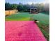 Landscaped backyard features a gazebo and a brick patio at 634 Friars Head Dr, Suwanee, GA 30024