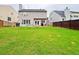 Spacious backyard with lush green lawn and privacy fence offers plenty of room at 634 Friars Head Dr, Suwanee, GA 30024