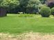 Spacious backyard with lush lawn and natural wildlife, great for outdoor enjoyment at 634 Friars Head Dr, Suwanee, GA 30024