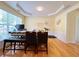 Sunny dining room features a large window and a modern table set at 634 Friars Head Dr, Suwanee, GA 30024