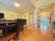Warm dining room offering hardwood floors, natural light, and view to the kitchen at 634 Friars Head Dr, Suwanee, GA 30024